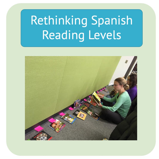 image of two people looking at books that are laying on the floor