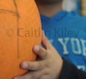 child holding a ball